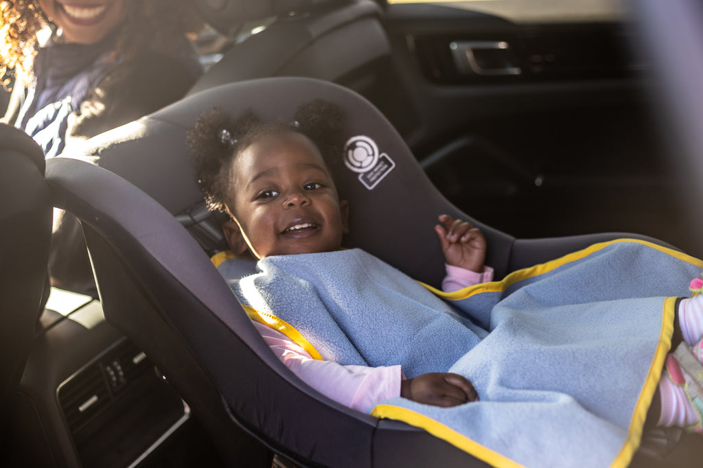 Car Seat Bib is a big, huge, oversized, supersize, large bib. It's specifically designed to drape over the lap of the child and is simultaneously absorbent and waterproof, working to catch and prevent messes from seeping and spilling.