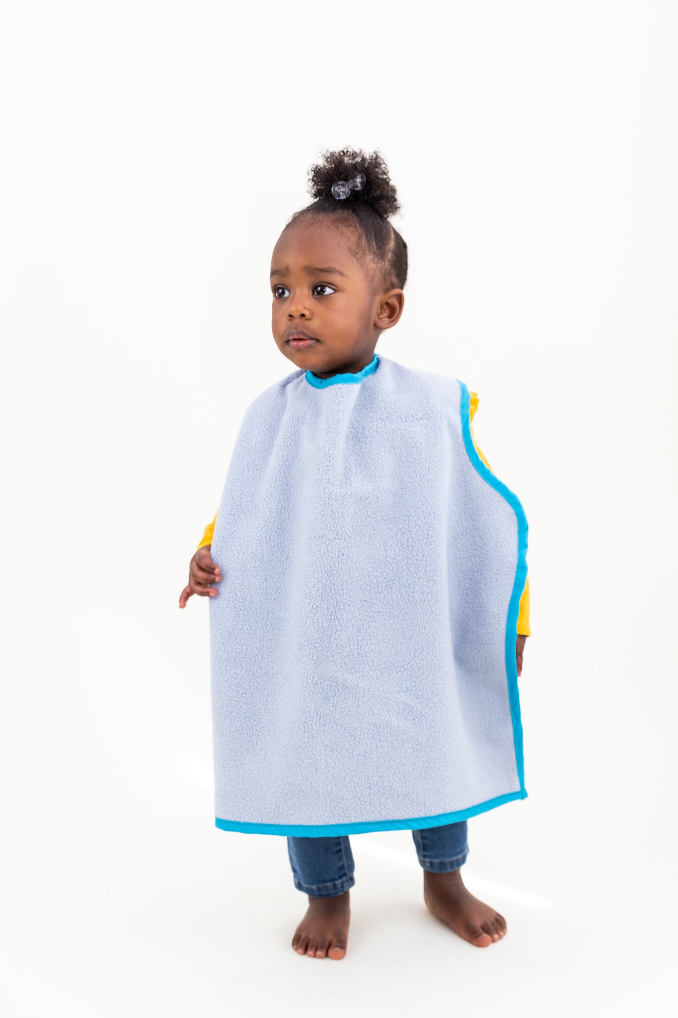 Oversized at 24" long x 19" wide, Car Seat Bib is soft, lightweight, breathable, washable, organic, kid-safe, toxin-free, eco-friendly, and made in the USA.